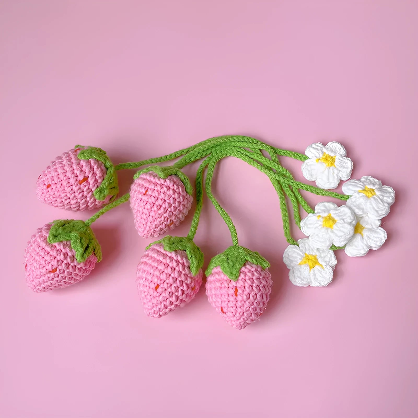 Wool crochet strawberry pendant necklace in pink colour with textured knitting details