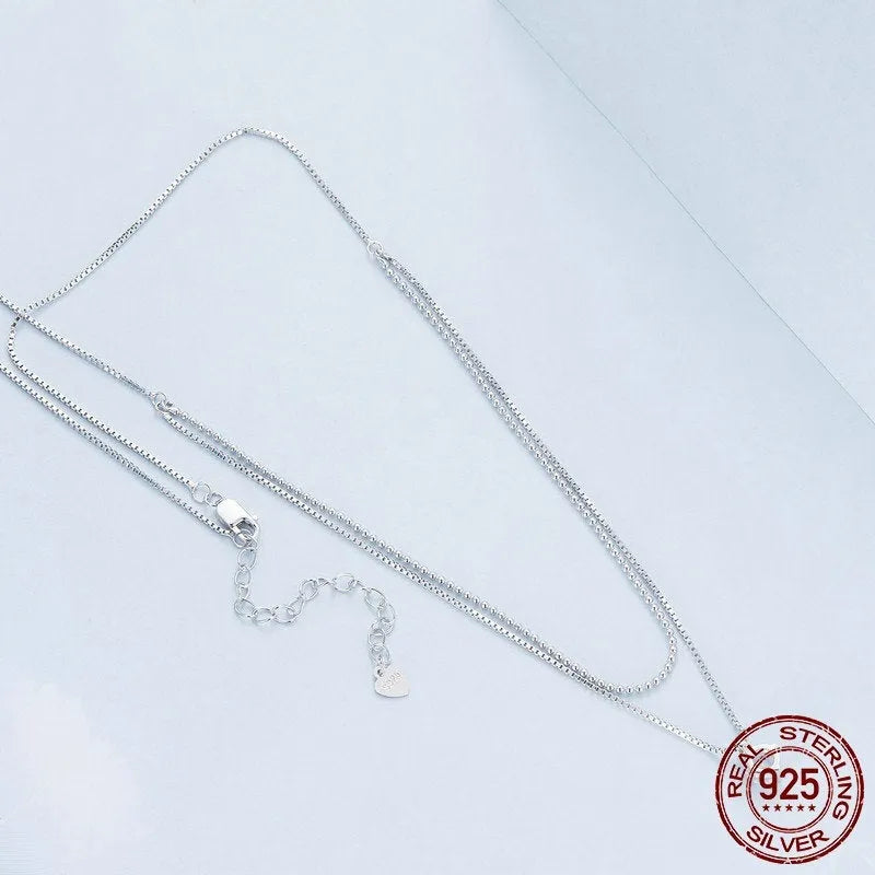 Double-layer sterling silver necklace with pearl chain and silver pendant