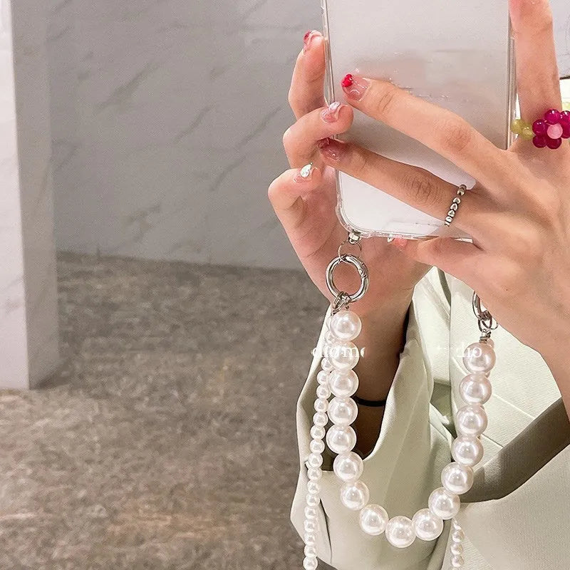 Soft iPhone case with large white pearl decoration and silver chain in Japanese Korean style.