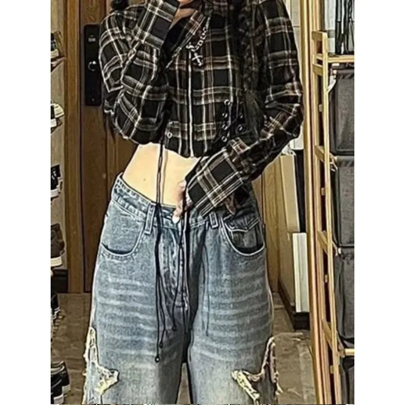Blue high-waisted wide-leg denim jeans with straight-leg design on hanger