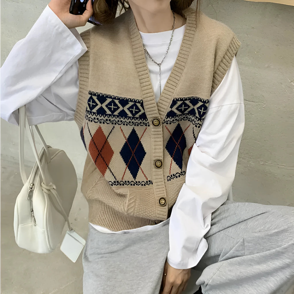Khaki diamond plaid sleeveless loose cardigan top on a hanger.