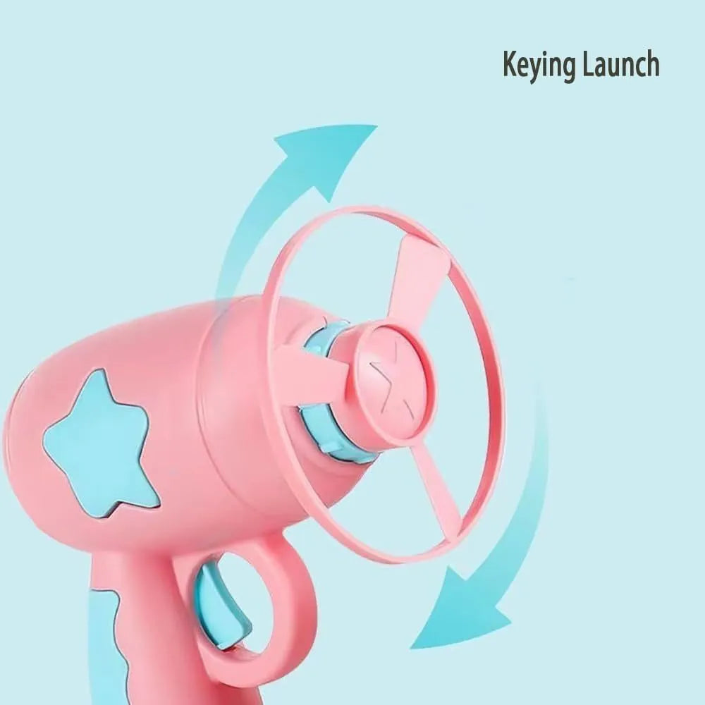 Blue plastic cat toy gun with spinning Frisbee ready for launch