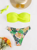 Split push up hard cup bikini swimsuit in fluorescent green on a mannequin.