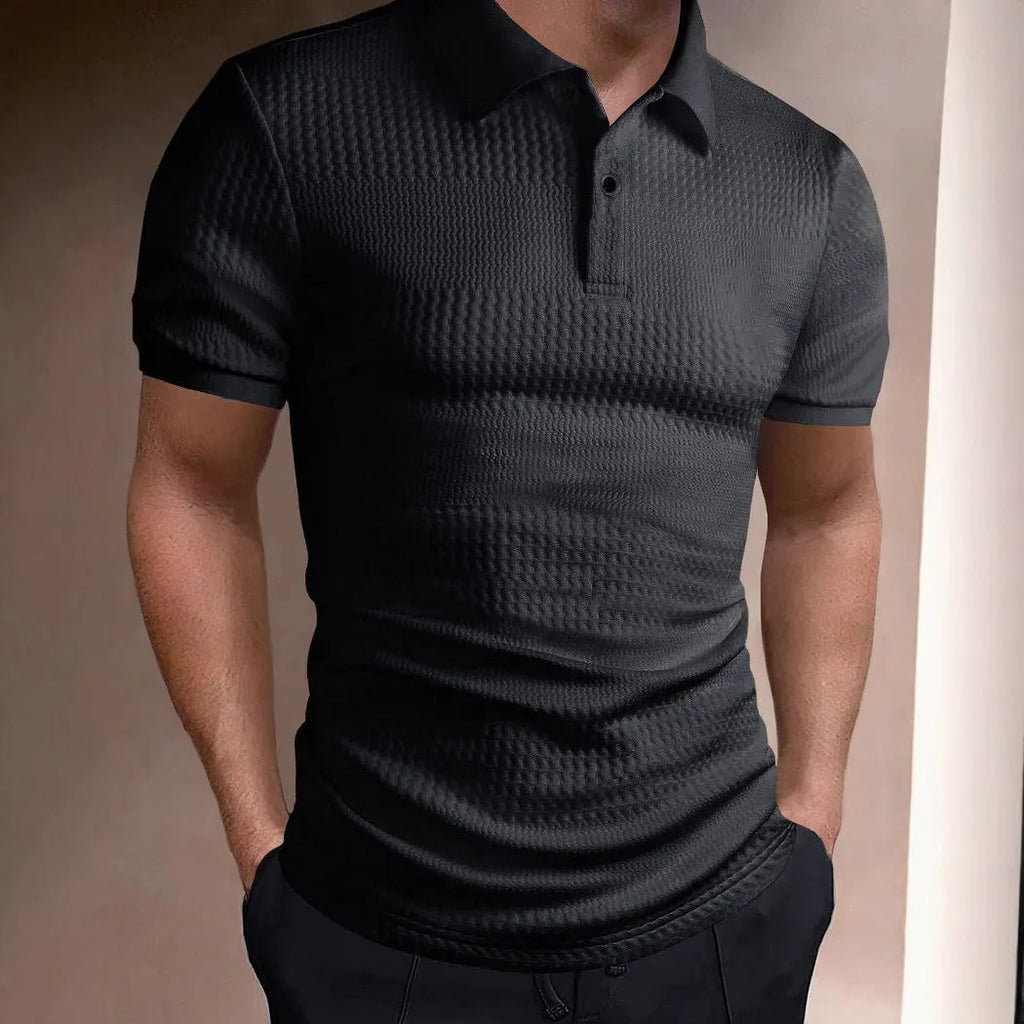 Man wearing a striped loose-fit polo shirt with an asymmetric design in light blue.