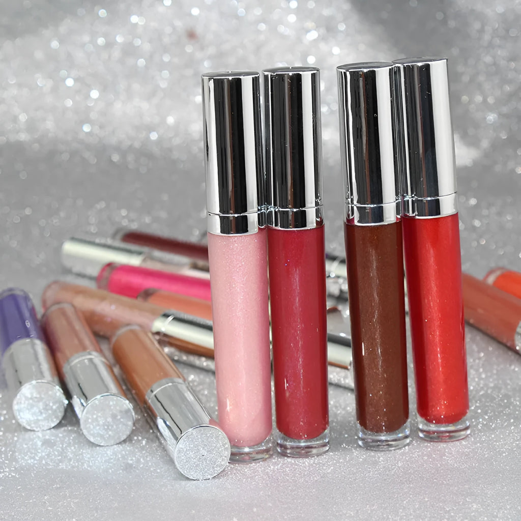 Pearl lip gloss clear lip oil in a logo-free round tube with mirror, pearl light, and water light finish