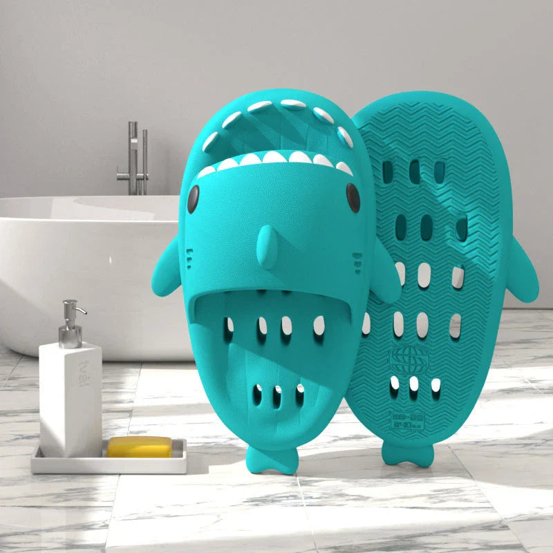 Shark-inspired shower slides with drain holes, featuring authentic shark design details and quick-drying EVA material