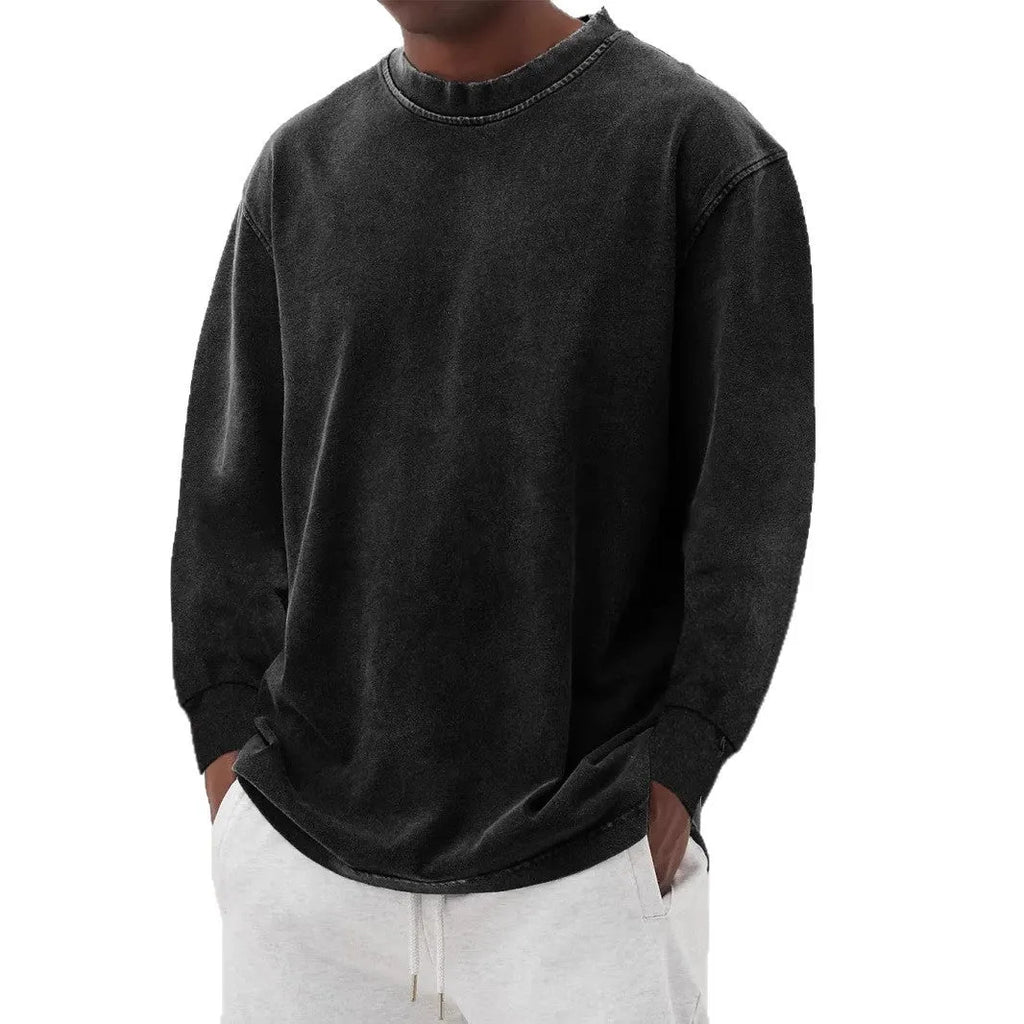 Man wearing a slim fit long sleeve t-shirt in a solid colour, with options in sky blue, green, gray, black, and camel.