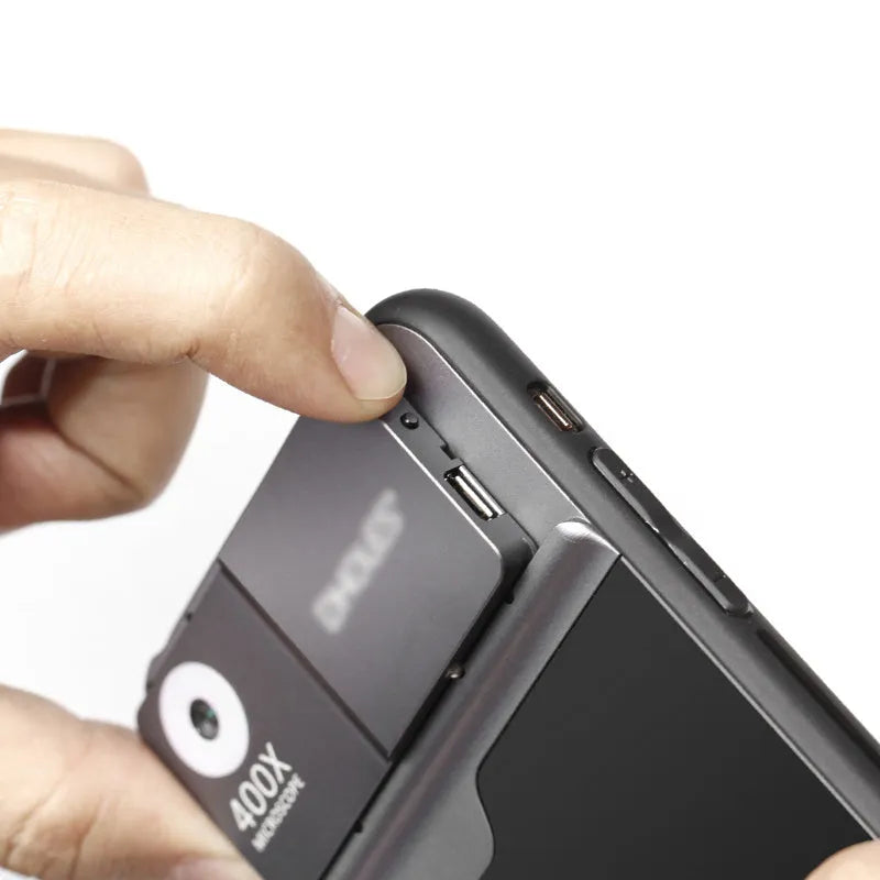 Black and silver 400X mobile phone microscope lens with aluminum alloy TPU case for iPhone.
