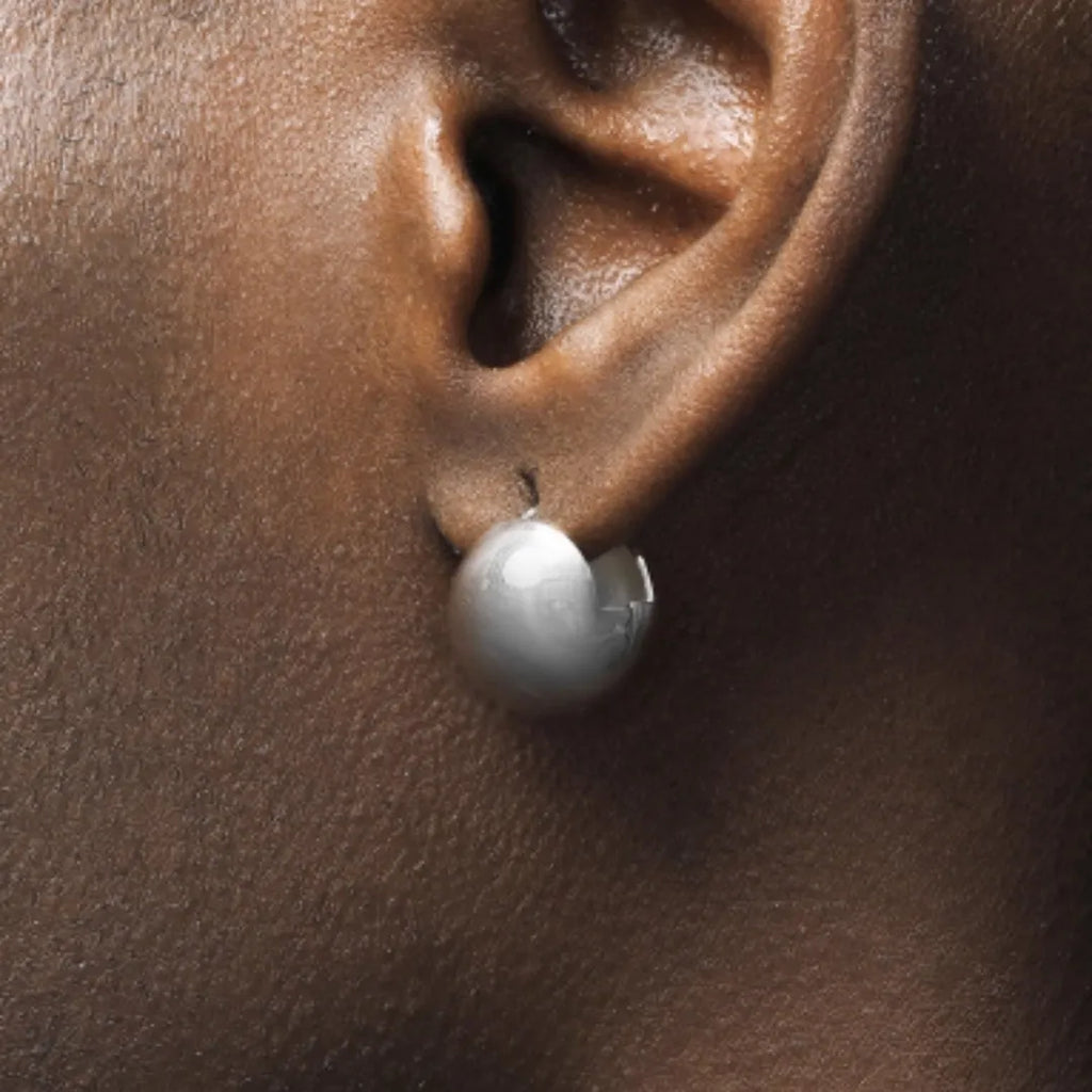 Pair of 925 sterling silver hip-hop style stud earrings for men and women on white background