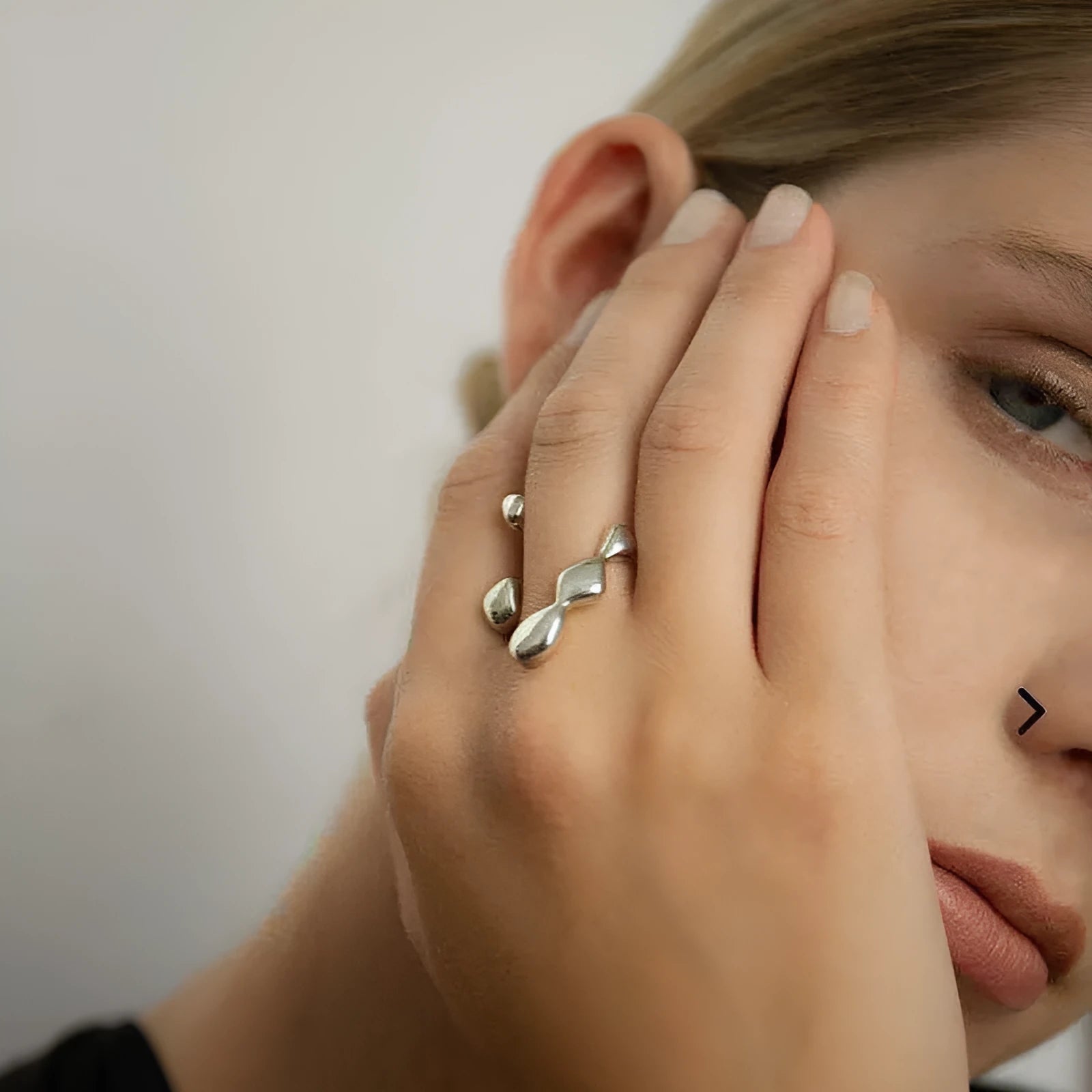 Brass opening ring for women with spherical design in gold or silver finish.