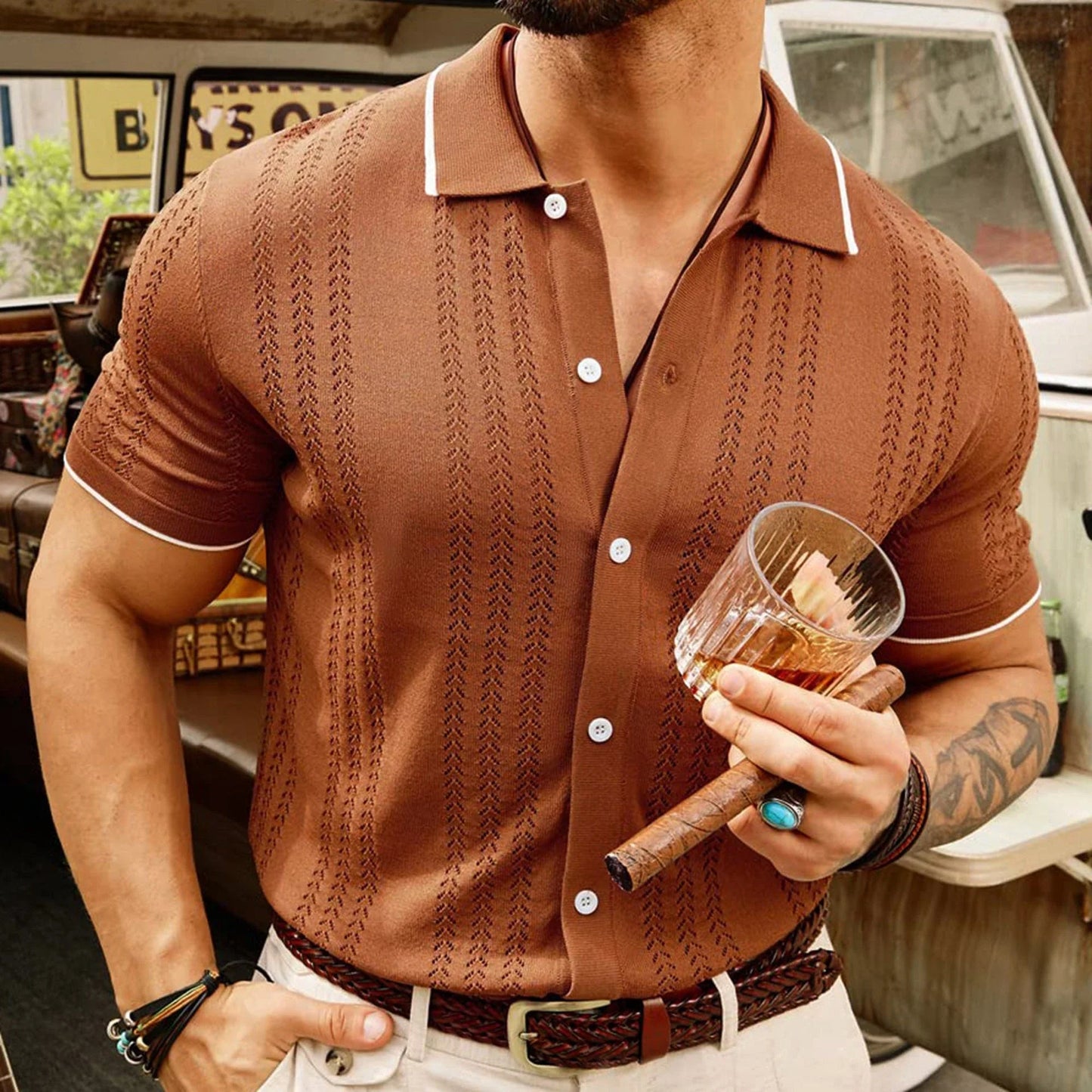 Short-sleeve polo shirt in brown, navy blue, and khaki colors with unique flocked design and regular fit