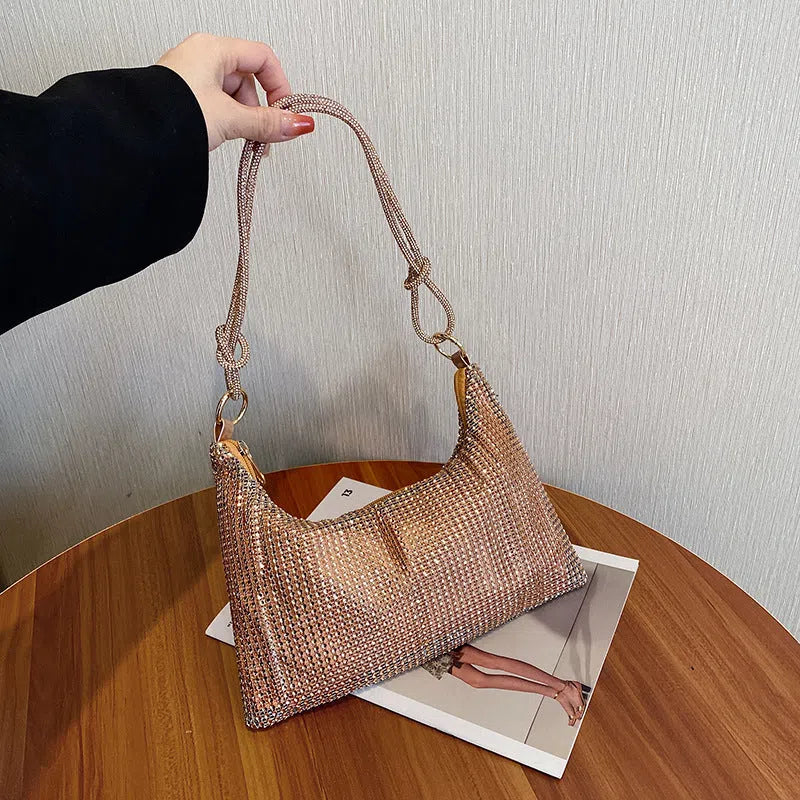 Women's solid-colour nylon shoulder bag with faux rhinestone details, chain strap, and zipper closure in silver