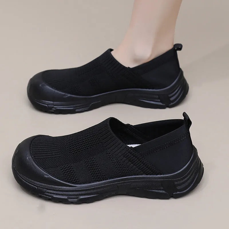 Women's black slip-on shoes with cloth uppers and soft PVC soles
