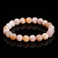 Cherry agate bracelet in natural cherry blossom colour with round geometric beads.
