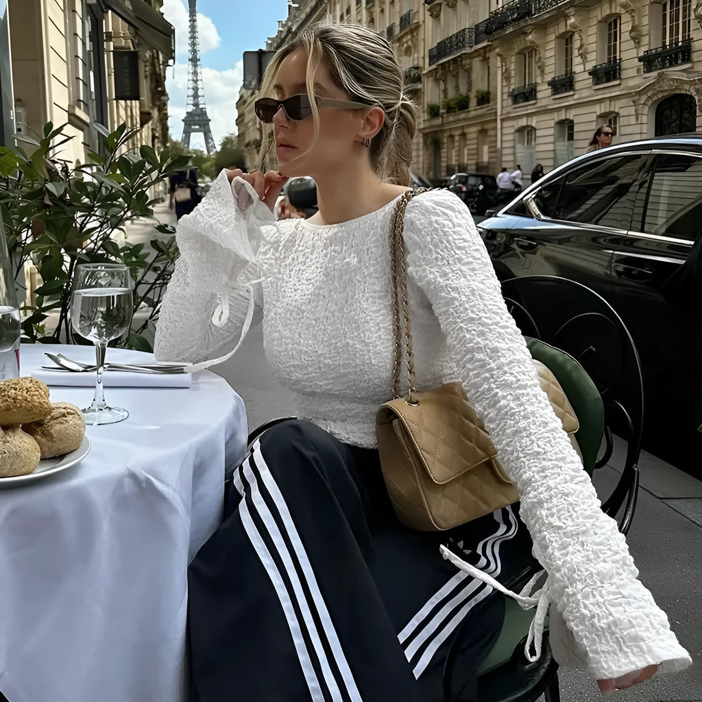 White lace-up backless long sleeve cardigan on a woman for casual layering