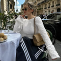 White lace-up backless long sleeve cardigan on a woman for casual layering
