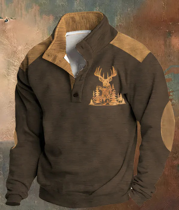 Man wearing a loose grey sweater with a blue 3D geometric digital print pattern and four buttons.