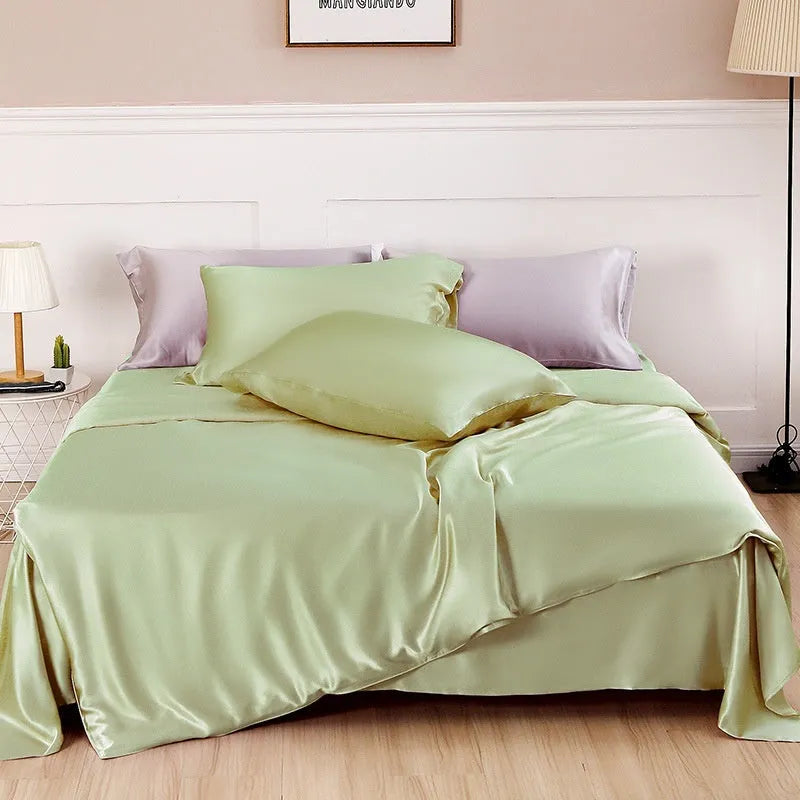 Silk duvet cover in a solid colour, shown in one of six colour options including Lotus Pink and Silver Blue.