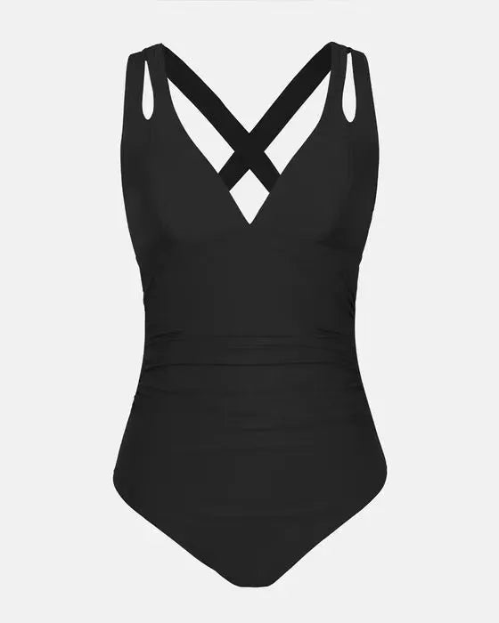 Solid colour one-piece swimsuit with a triangle bikini top and cross shoulder straps.
