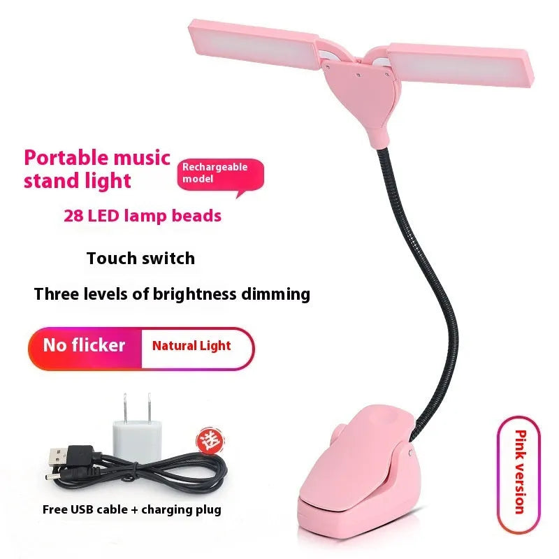 Black rechargeable music stand light with 28 LED lamps and USB cable on a metal music stand