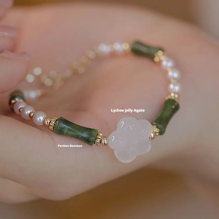 Chinese style olivine bamboo joint bracelet with Hetian jade and copper shell pearls on wrist
