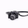 Plastic shrinking toy doll camera accessory with lanyard in digital style, packaged in net bag
