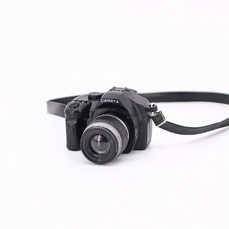 Plastic shrinking toy doll camera accessory with lanyard in digital style, packaged in net bag