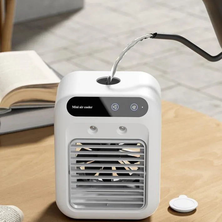 Compact ivory white portable USB air cooler with touchscreen display on a desk.