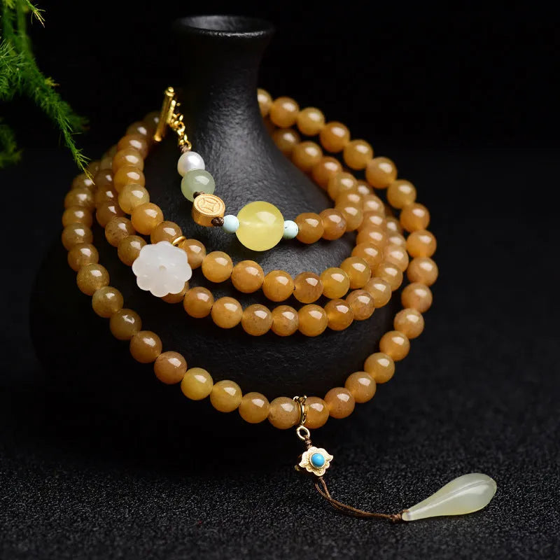 Women's natural bracelet with green pine beads, jade leaves, and beeswax accents