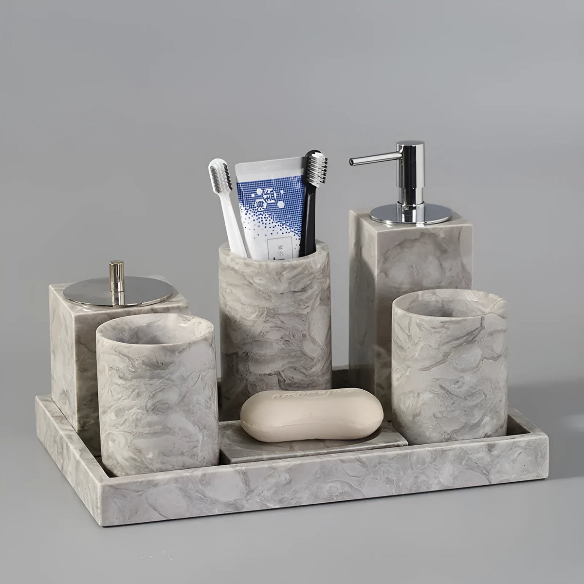 Marble bathroom toilet set with Overlord Flower pattern including tissue box, lotion bottle, and soap dish on white background.