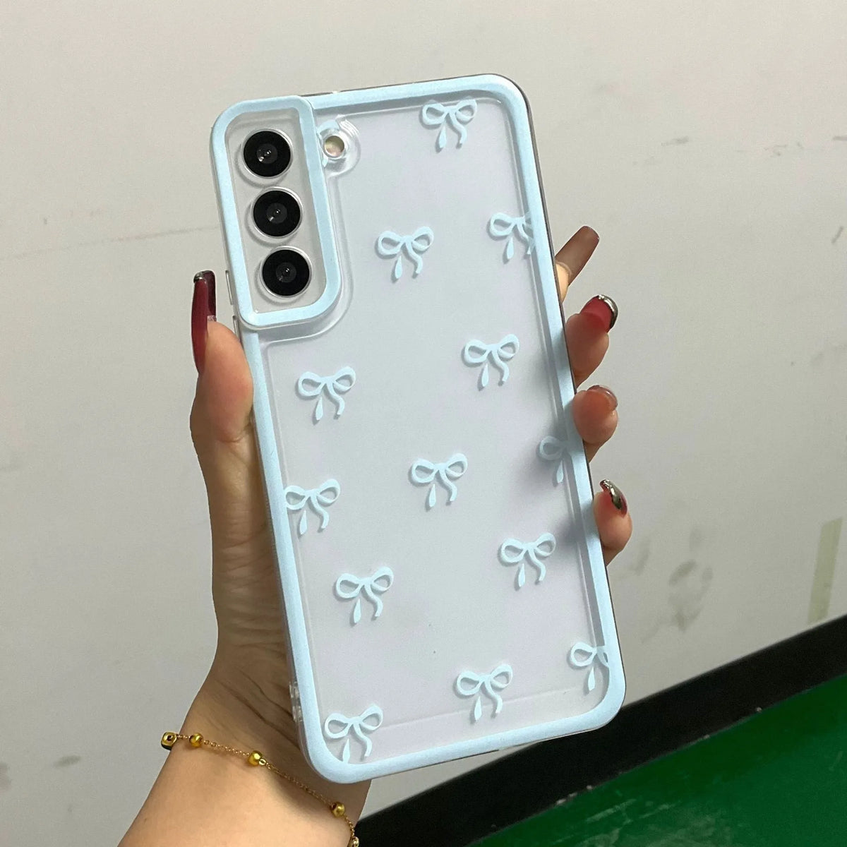 Transparent Samsung TPU phone case with three-dimensional bowknot design in blue, pink or purple bow options.