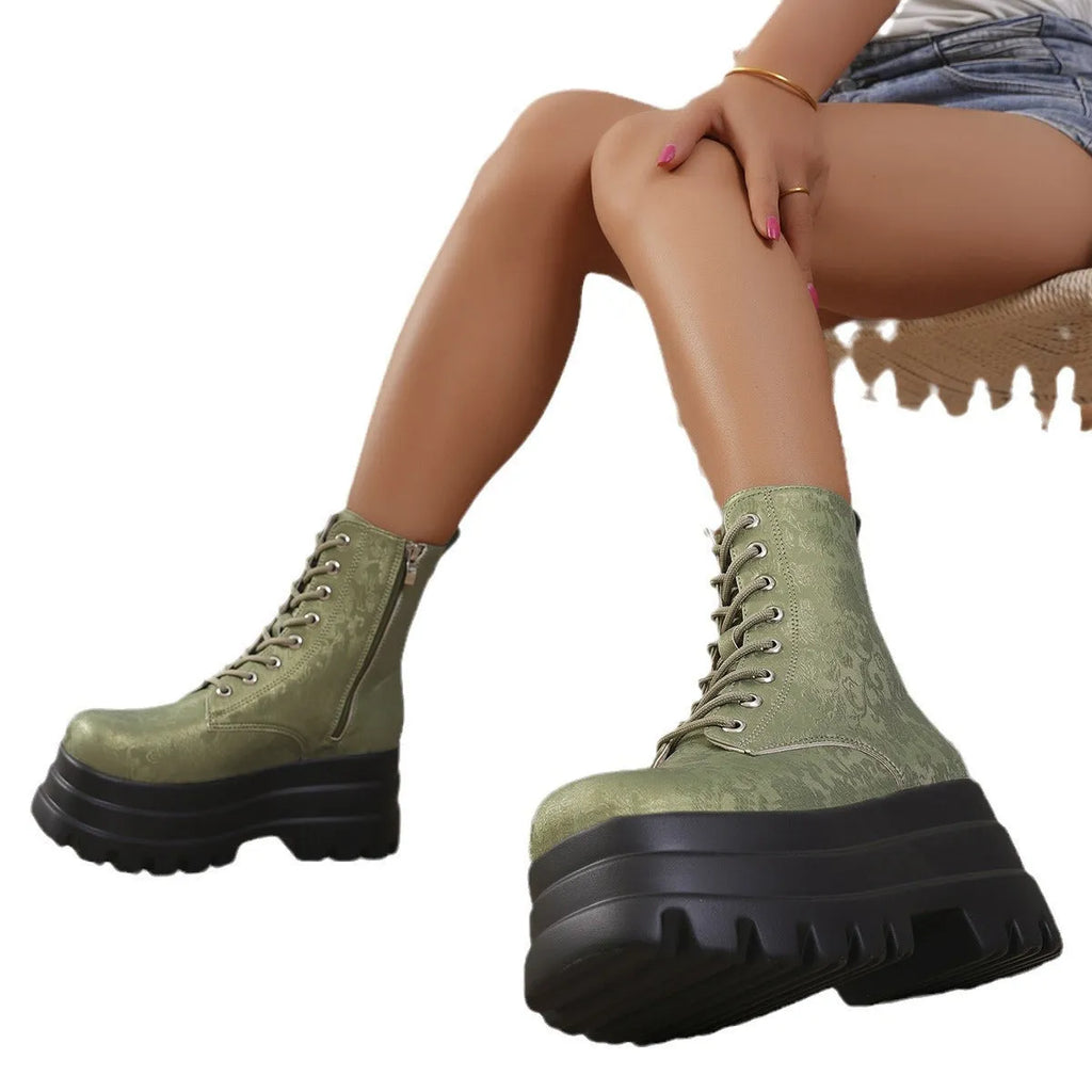 Women's white retro platform Martin boots with patchwork toe and side zipper on a chunky heel.