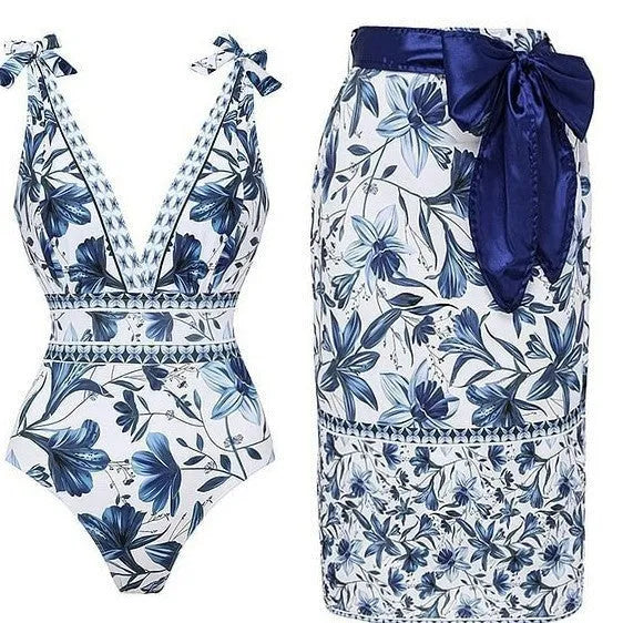Women's printed one-piece swimsuit with sleeveless design, polyester fabric and optional matching skirt in sizes S to XL.