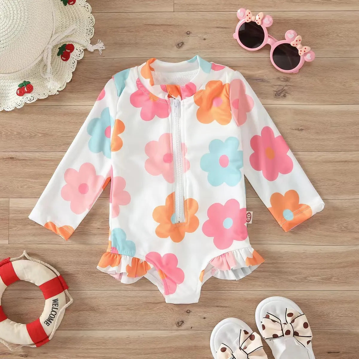 Girls' floral zipper romper swimsuit in pink with front zipper and brief-style bottom