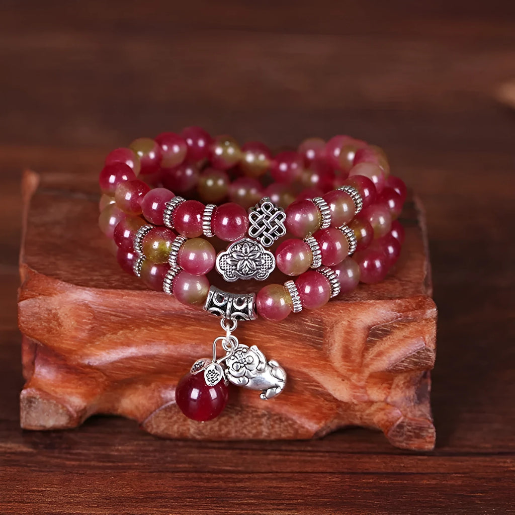 Handmade natural watermelon crystal Chinese knot bracelet in geometric elephant style.