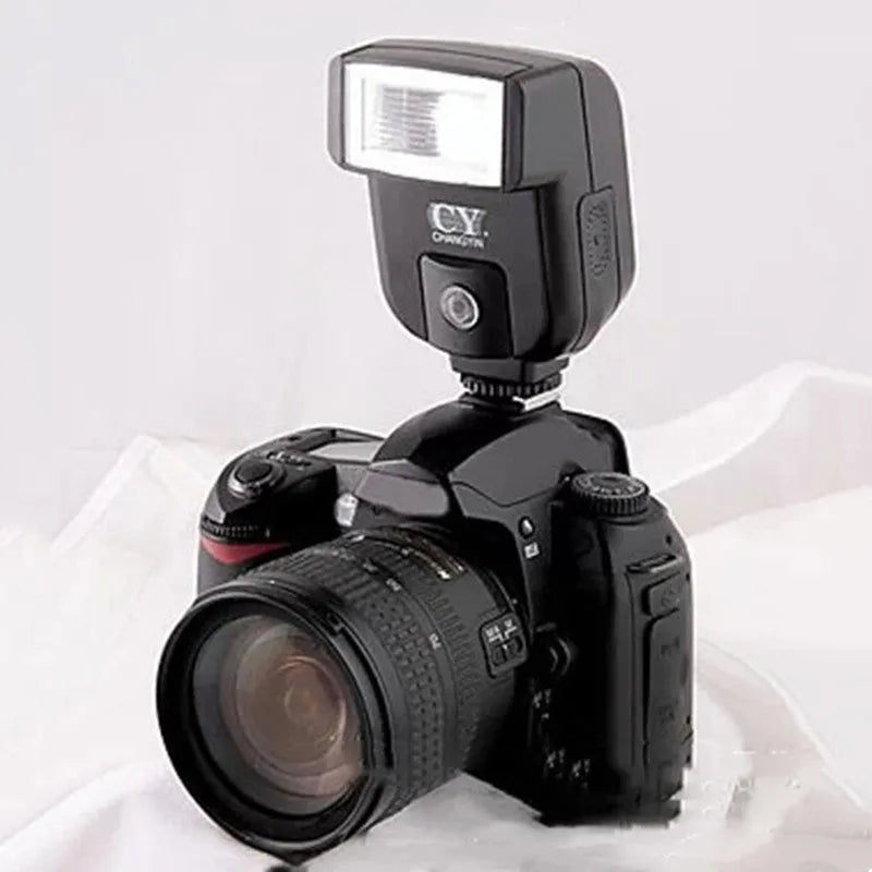 Compact SLR camera flash accessory with its head tilted upwards, showing its 90-degree adjustment range on a hot shoe.