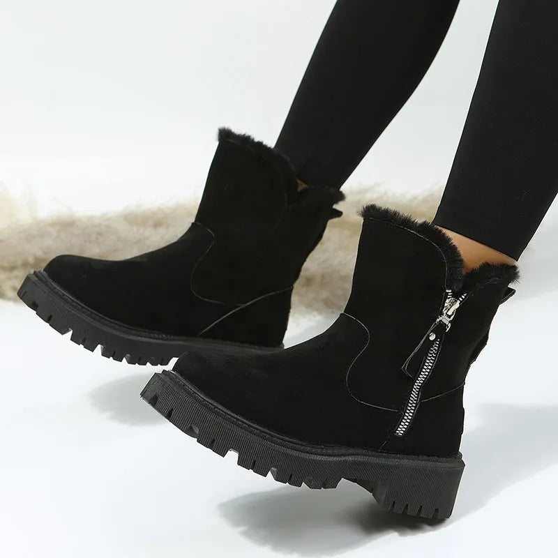 Women's black high-top snow boot with side zip, faux fur lining visible, and a rubber sole.