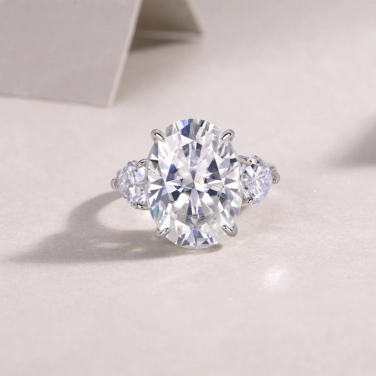Soul Resonance wedding ring set with egg-shaped moissanite in platinum-plated S925 silver on a white background