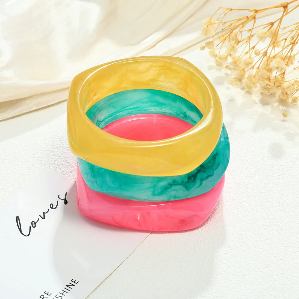 Resin arc bracelet in coffee colour with geometric blooming design and electroplating finish