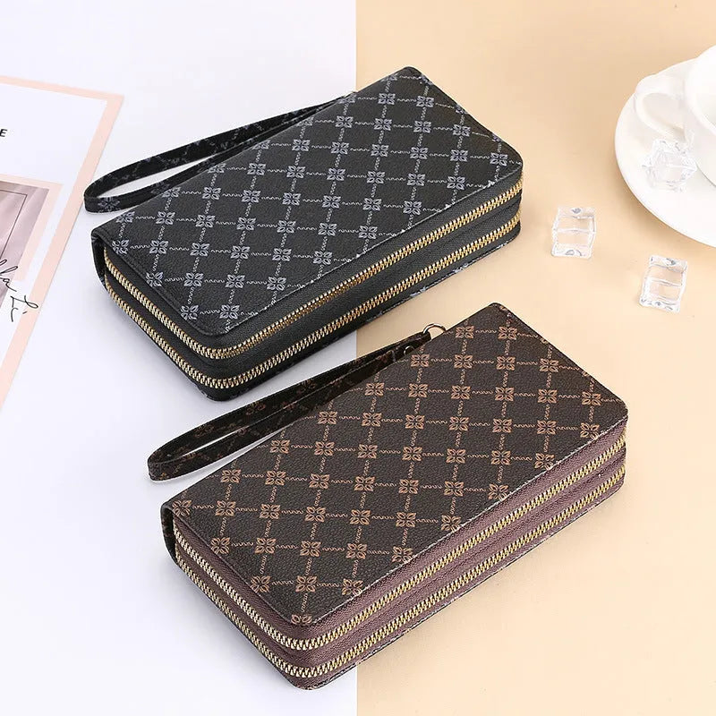 Long PU leather wallet clutch with zip closure and retro print decoration showing internal compartments