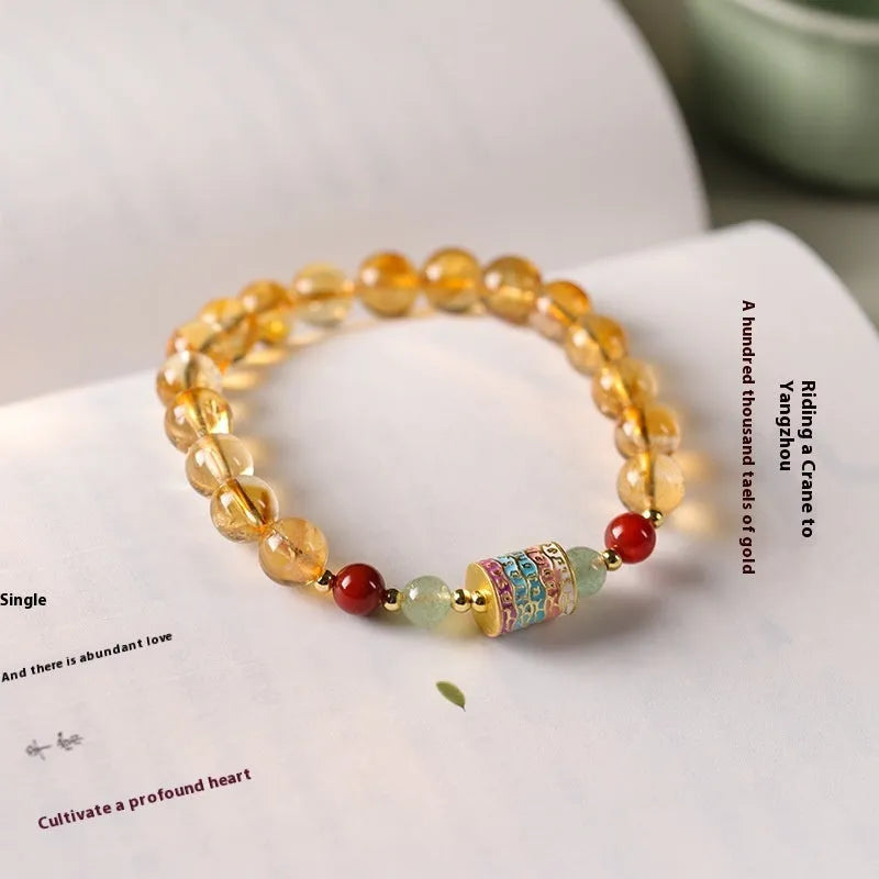 Yellow citrine prayer wheel bracelet with 8mm round beads and adjustable fastening