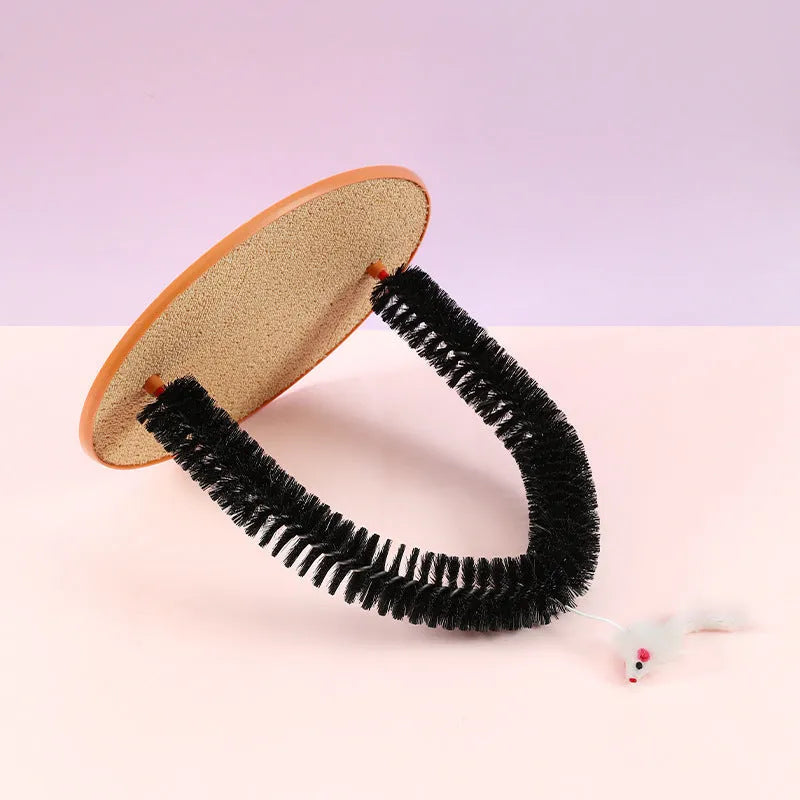 Black arch-shaped cat scratching post with grooming brush and attached mouse toy on non-slip base