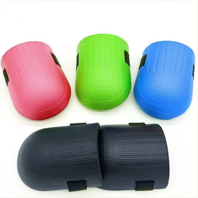 A pair of thick EVA foam kneepads for auto repair and construction work.