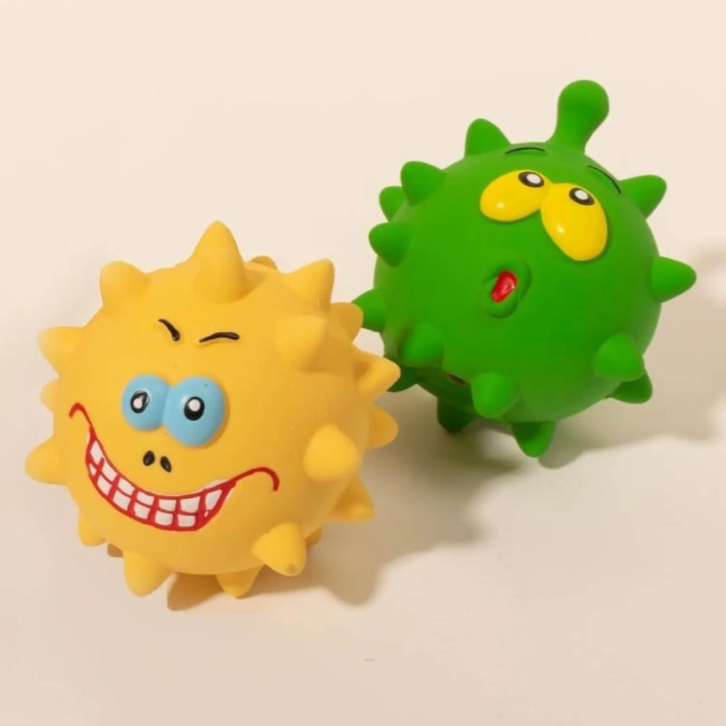 Four colourful natural latex dog squeaky balls with textured surfaces and cute faces