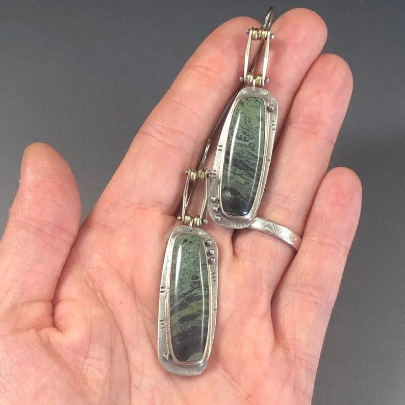 Geometric two-colour marble pattern alloy drop earrings showing marbled surface detail