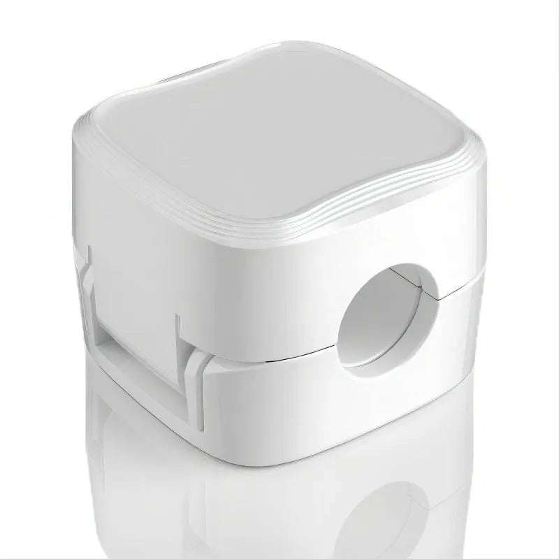 White and black magnetic cable clips with adhesive backing organising multiple cables under a desk