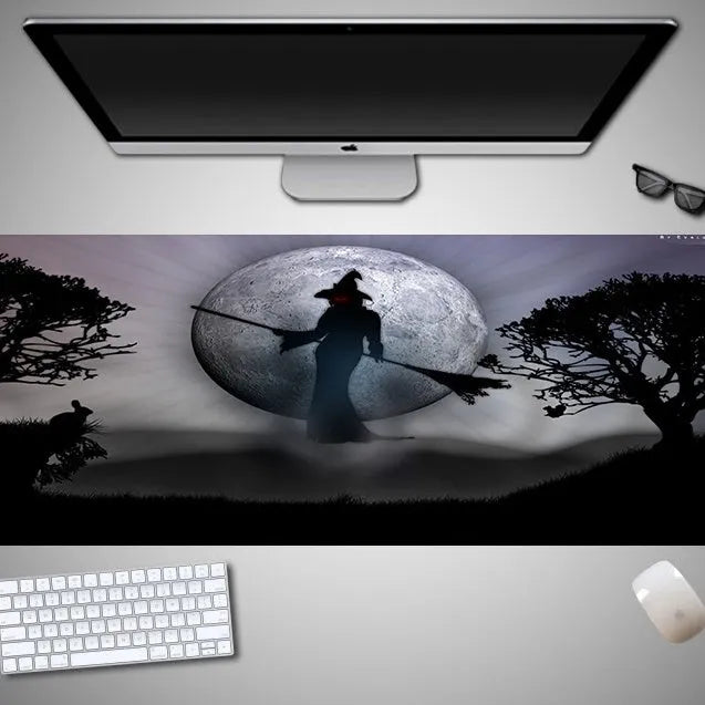 Oversized Halloween gaming mouse pad with non-slip rubber base on a desk