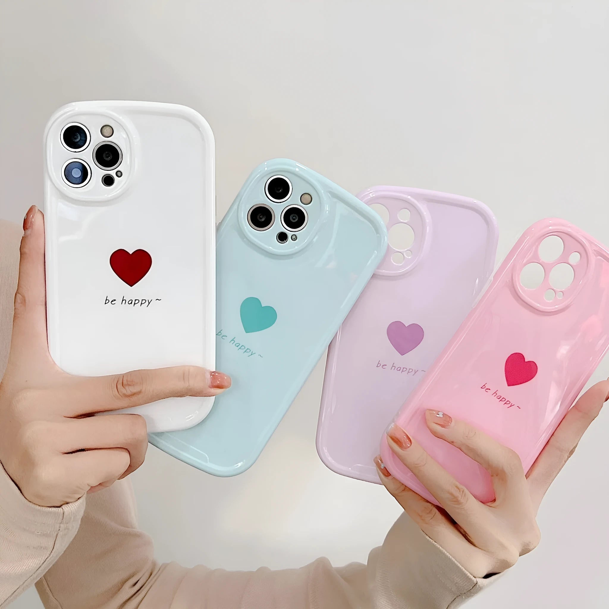 Cute macaron colour love phone case for iPhone in pink, purple, blue, and white options with TPU PC hard back cover