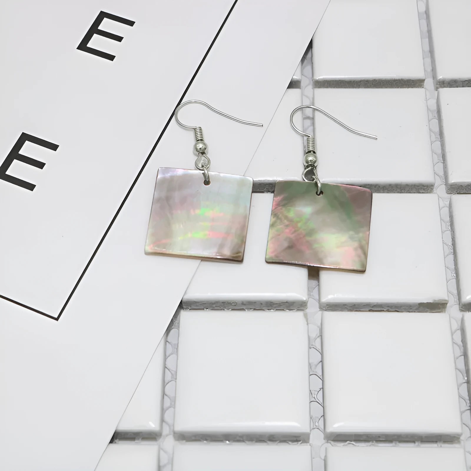 Natural shell geometric earrings in square panther and rectangular shell designs