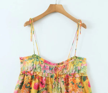 Elegant floral suspender dress with ruffled design, perfect for summer fashion